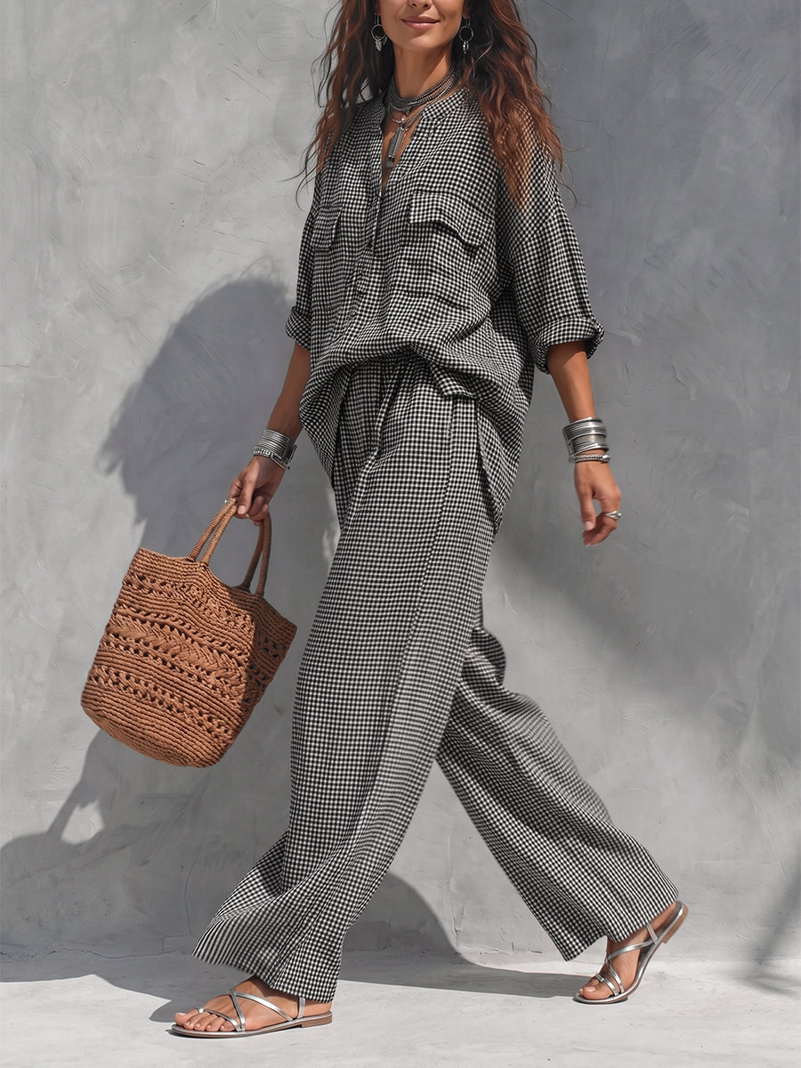 Women's black and white checked wide leg trousers with elastic waist and side pockets