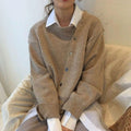 Women's oversized knit cardigan with asymmetric button front and long sleeves