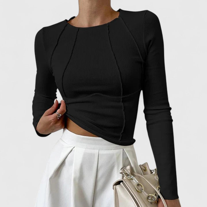 Women's ribbed long sleeve crop top with exposed seams and round neckline