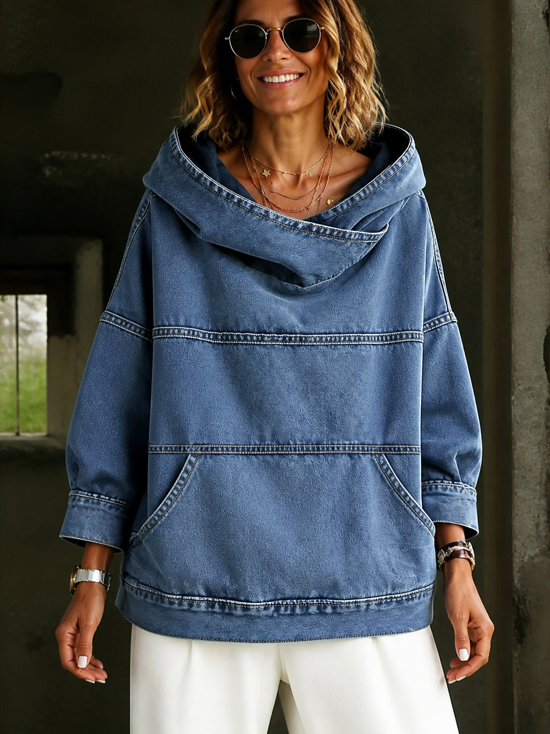 Women's blue hooded pullover with panelled seams and kangaroo pocket