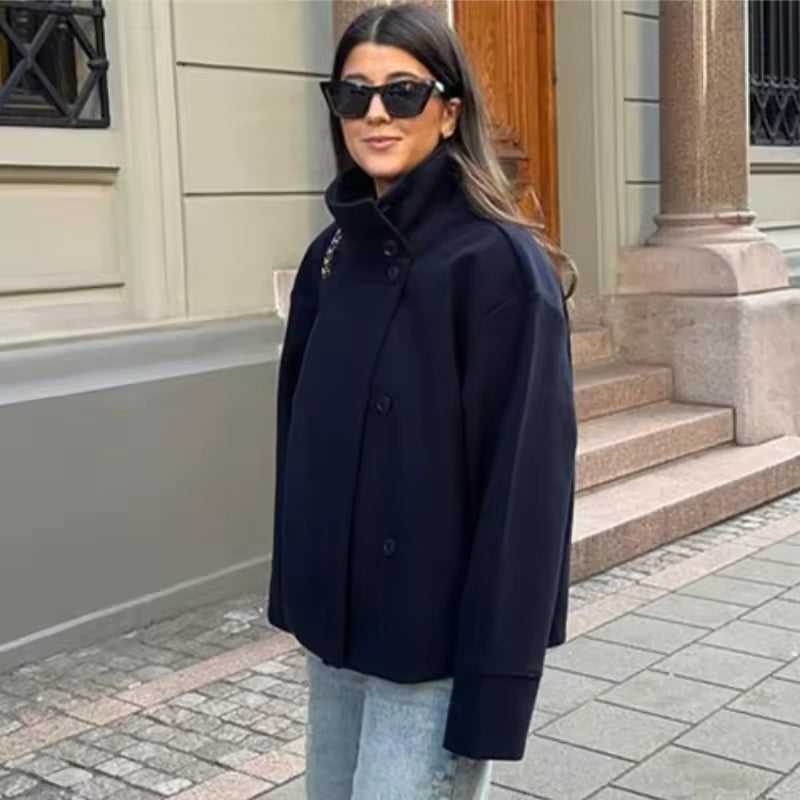 Women's oversized short coat with high neckline, long sleeves and button front