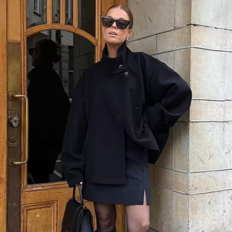 Women's oversized short coat with high neckline, long sleeves and button front