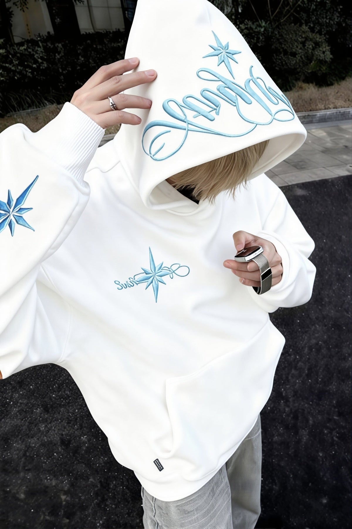 Pullover hoodie with embroidered star script, hood, long sleeves and front pouch pocket