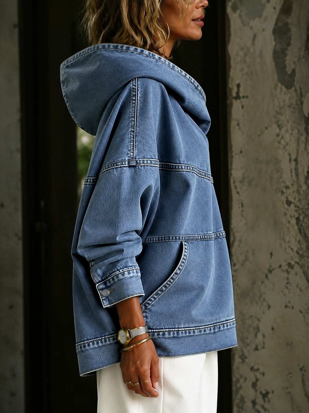 Women's blue hooded pullover with panelled seams and kangaroo pocket