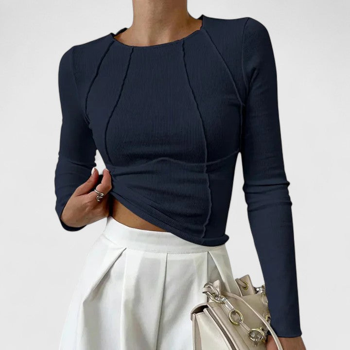 Women's ribbed long sleeve crop top with exposed seams and round neckline