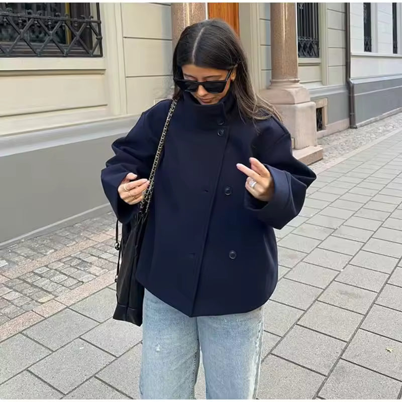 Women's oversized short coat with high neckline, long sleeves and button front