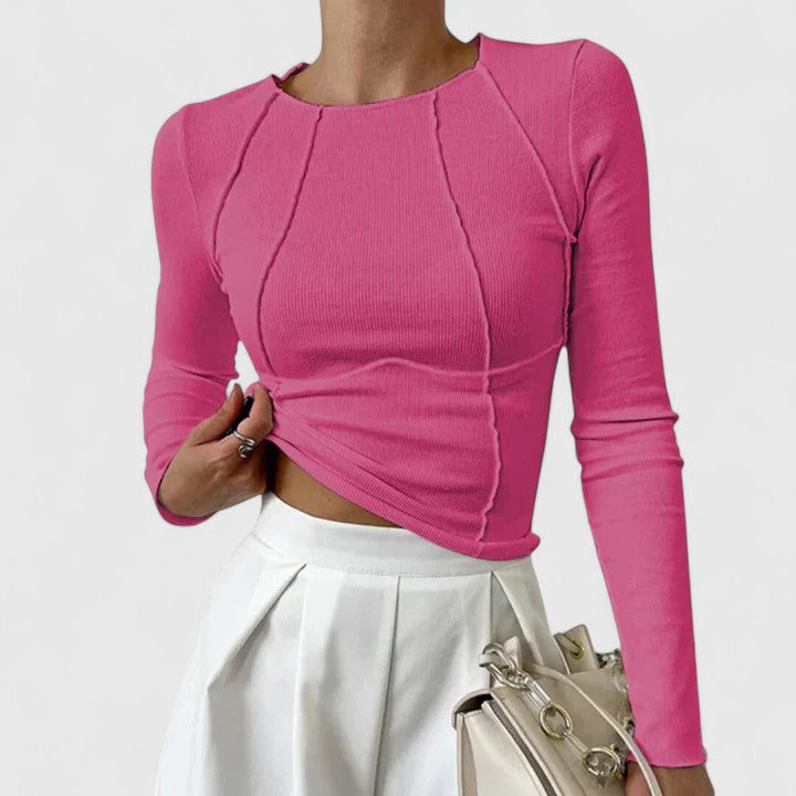 Women's ribbed long sleeve crop top with exposed seams and round neckline