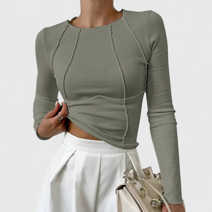 Women's ribbed long sleeve crop top with exposed seams and round neckline