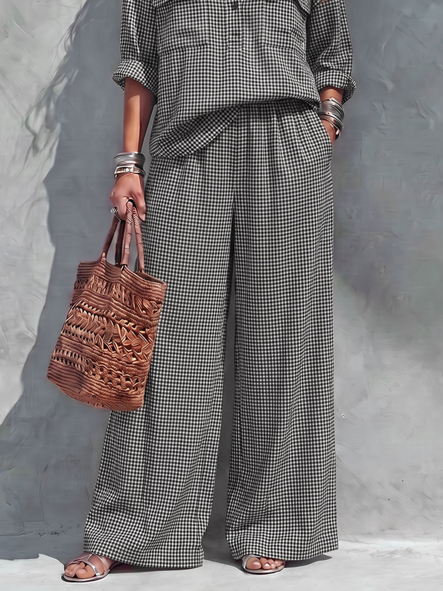 Women's black and white checked wide leg trousers with elastic waist and side pockets