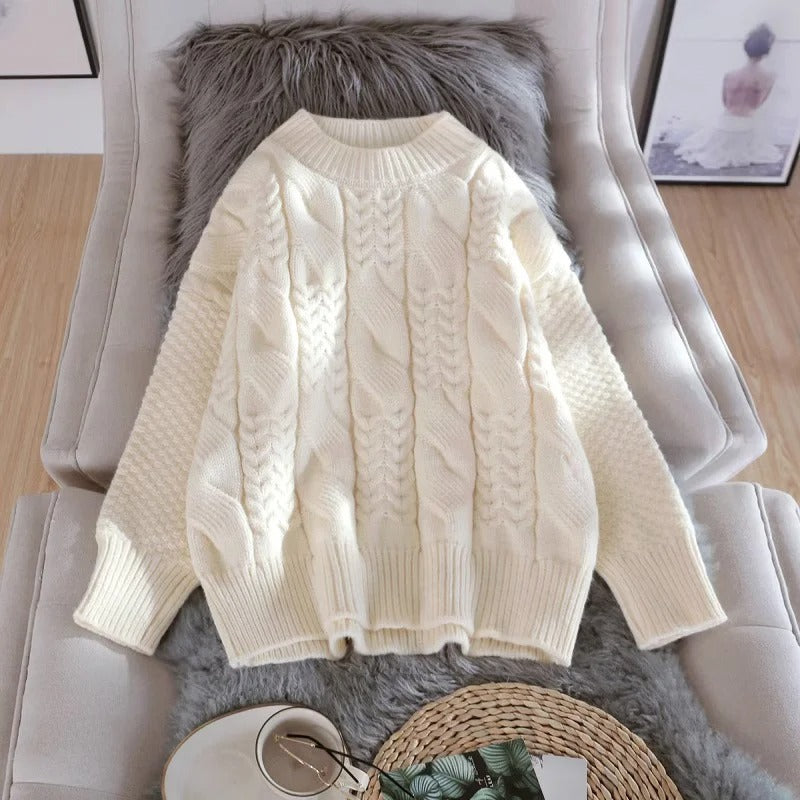Women's oversized cable knit mock neck sweater with long sleeves and ribbed trims
