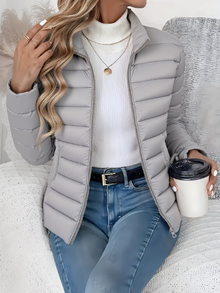 Women's quilted funnel neck puffer jacket with long sleeves and front zipper