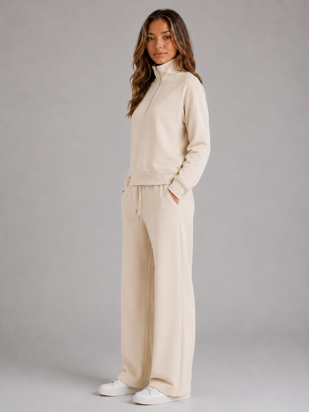 Women's quarter-zip sweatshirt and wide-leg joggers set with raised collar and drawstring waist