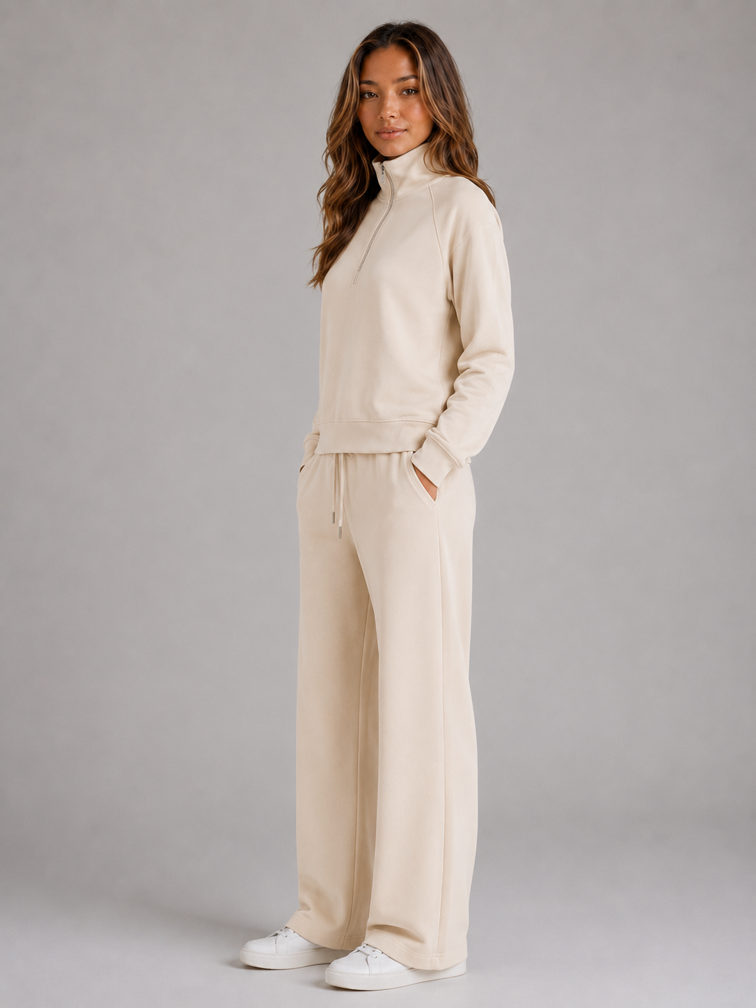 Women's quarter-zip sweatshirt and wide-leg joggers set with raised collar and drawstring waist