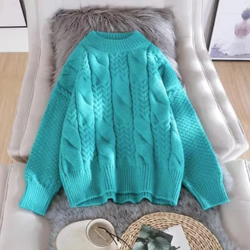 Women's oversized cable knit mock neck sweater with long sleeves and ribbed trims