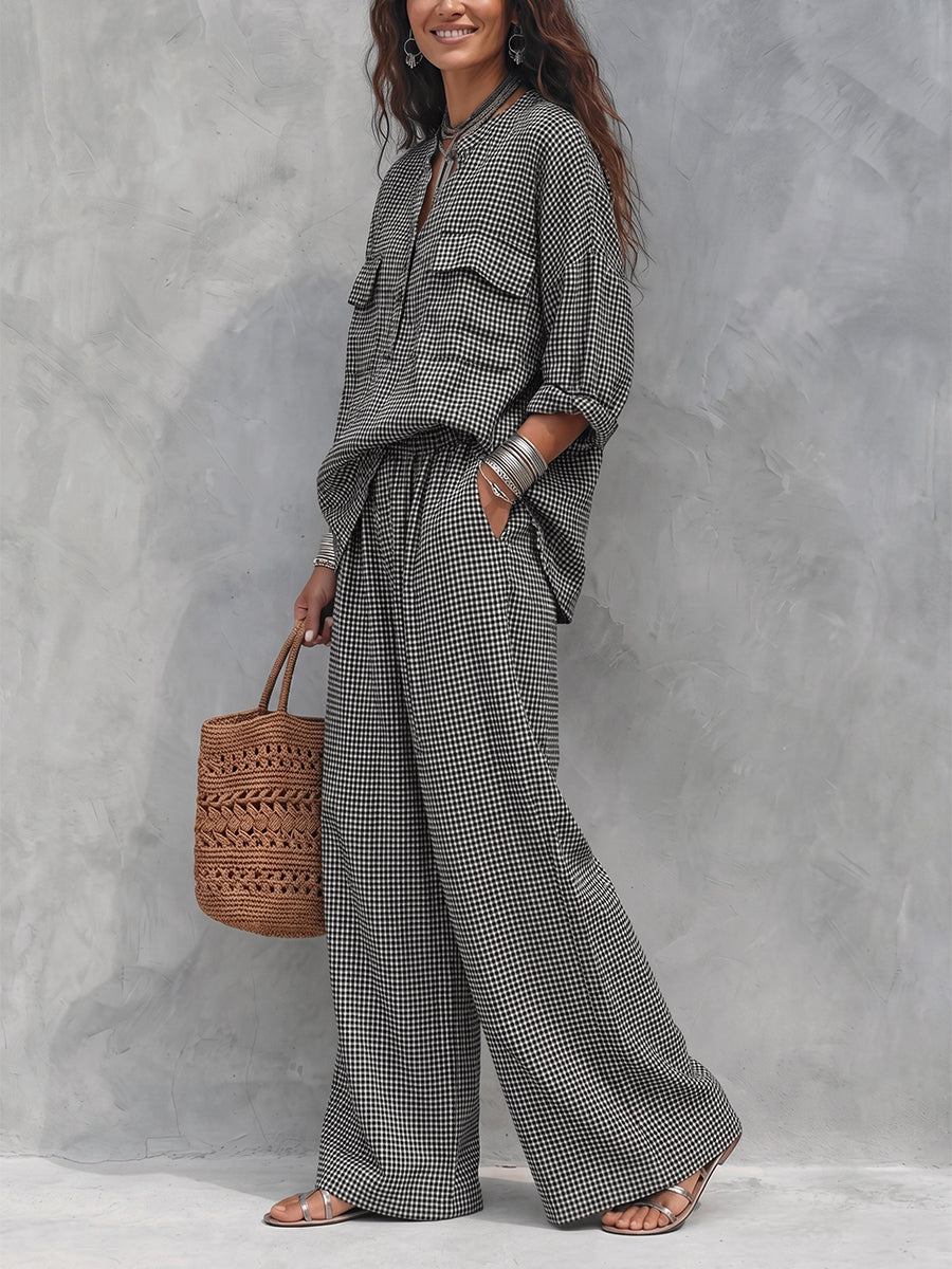 Women's black and white checked wide leg trousers with elastic waist and side pockets
