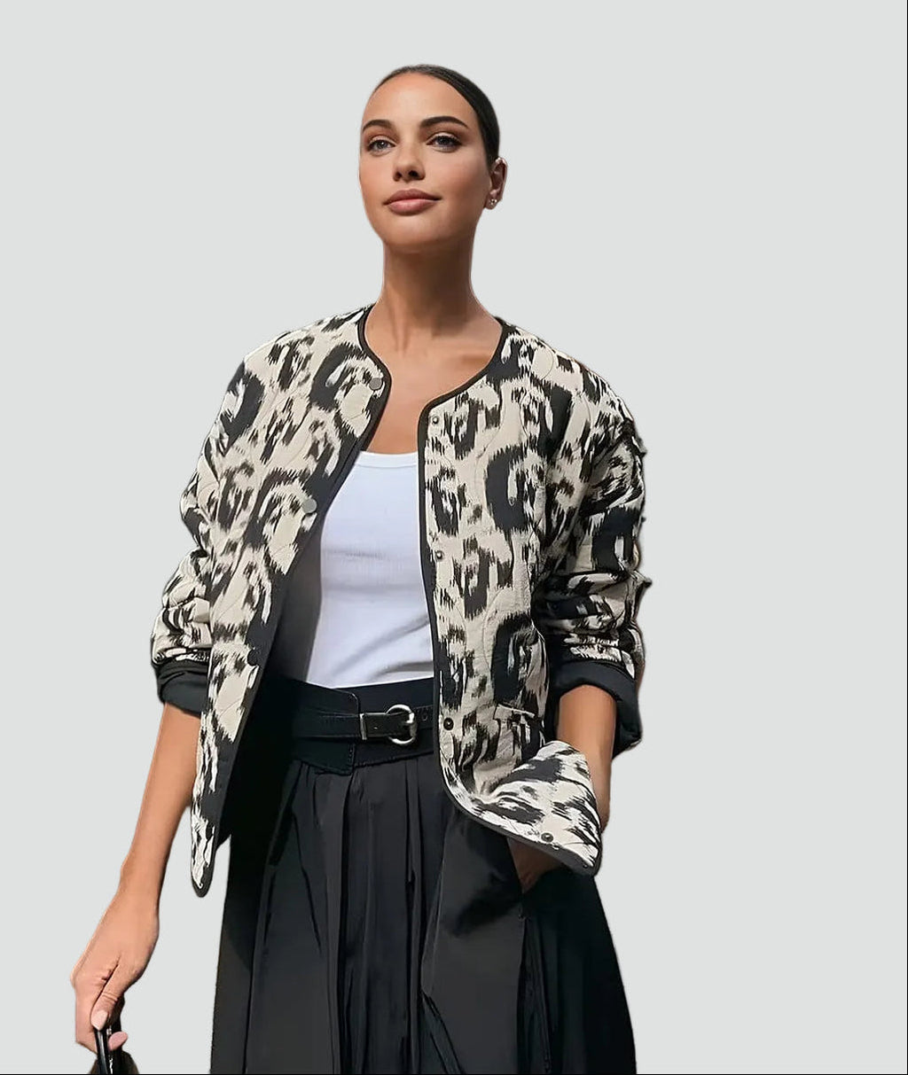 Women's black and white abstract animal print quilted collarless jacket