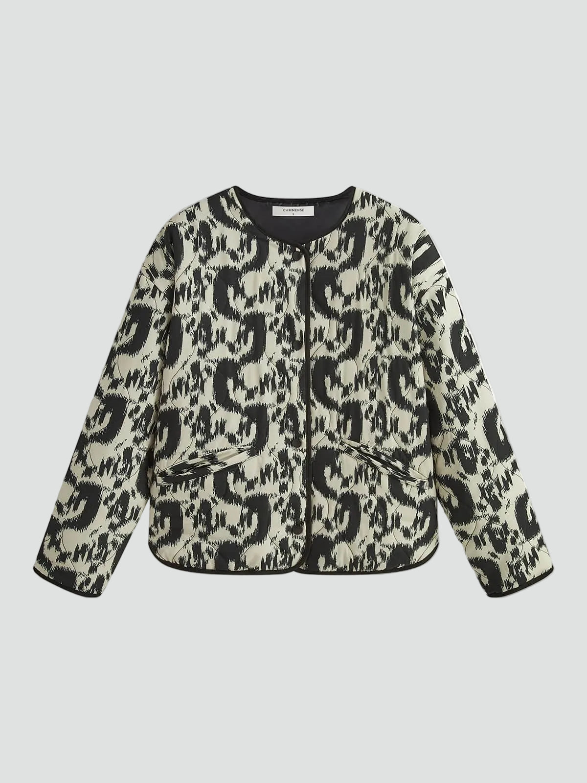 Women's black and white abstract animal print quilted collarless jacket