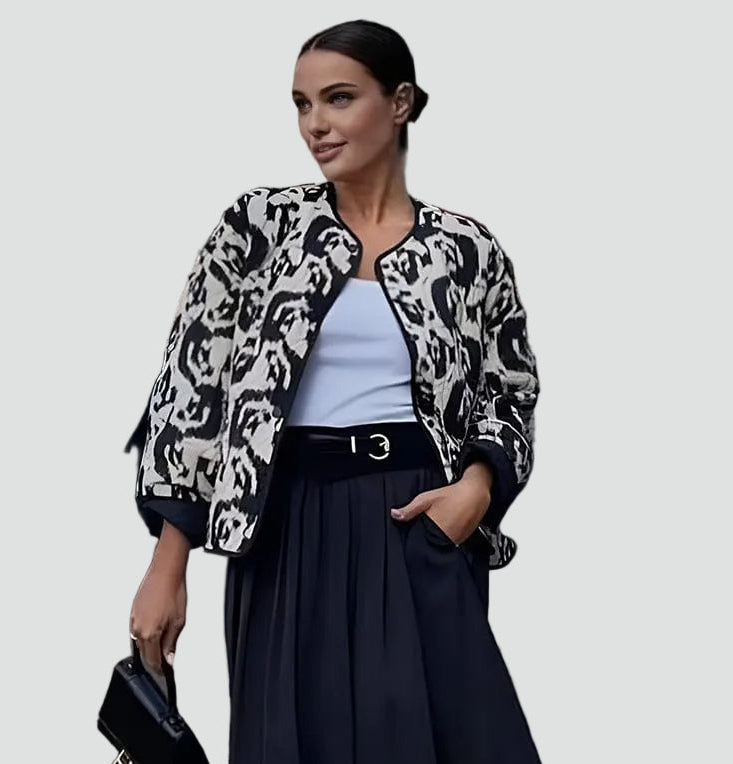 Women's black and white abstract animal print quilted collarless jacket