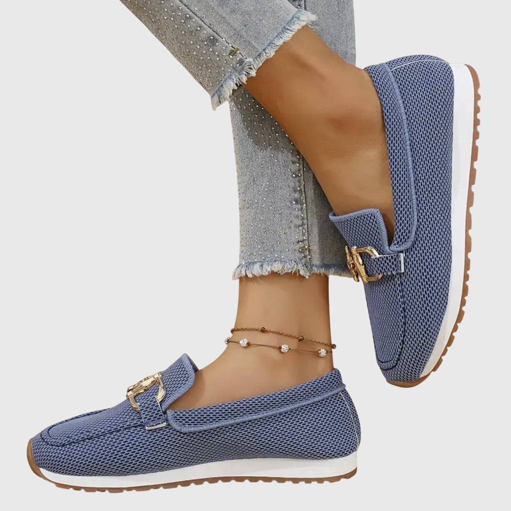 Women's textured loafer sneakers with rounded toes and decorative metal trims