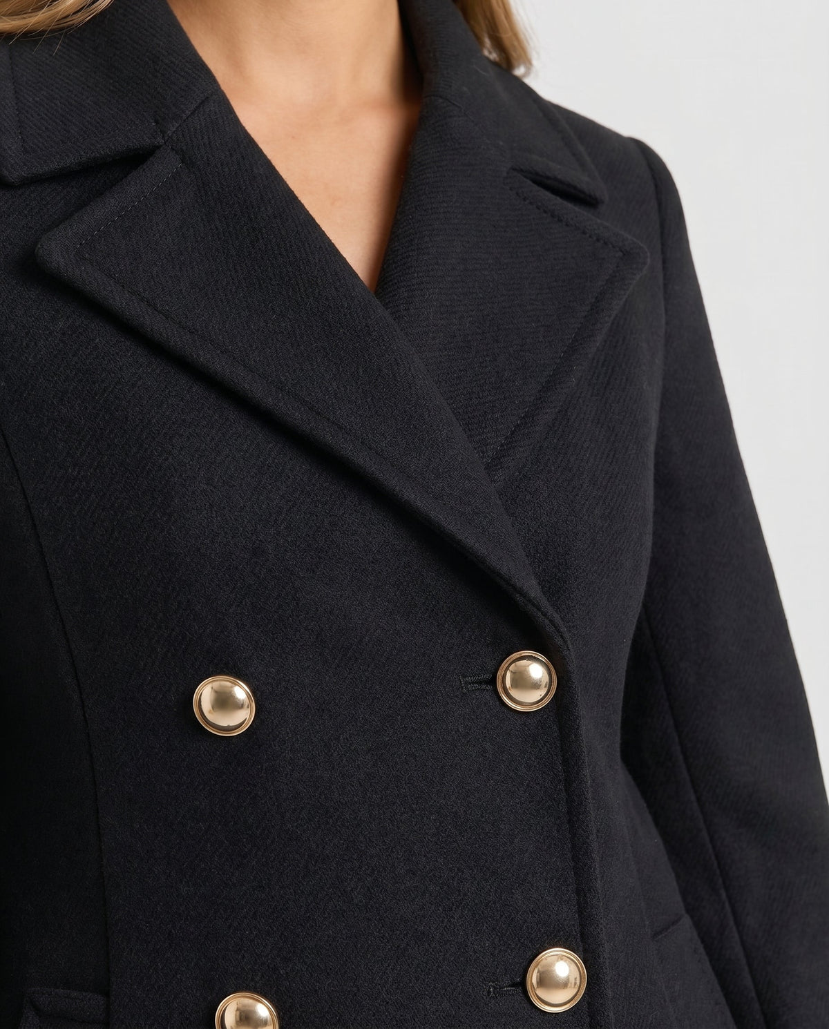 Women's black double-breasted maxi coat with notch lapels and long sleeves