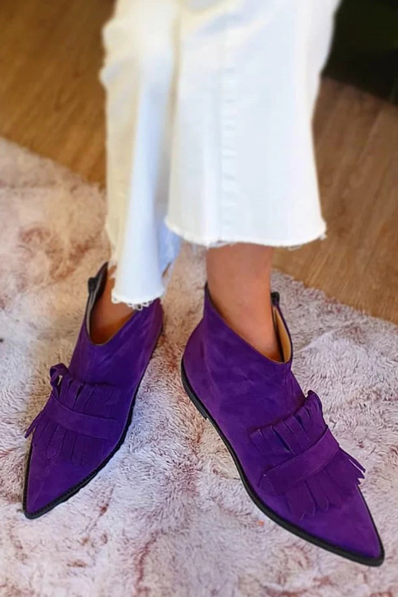 Purple pointed ankle boots with layered fringe panels and flat soles