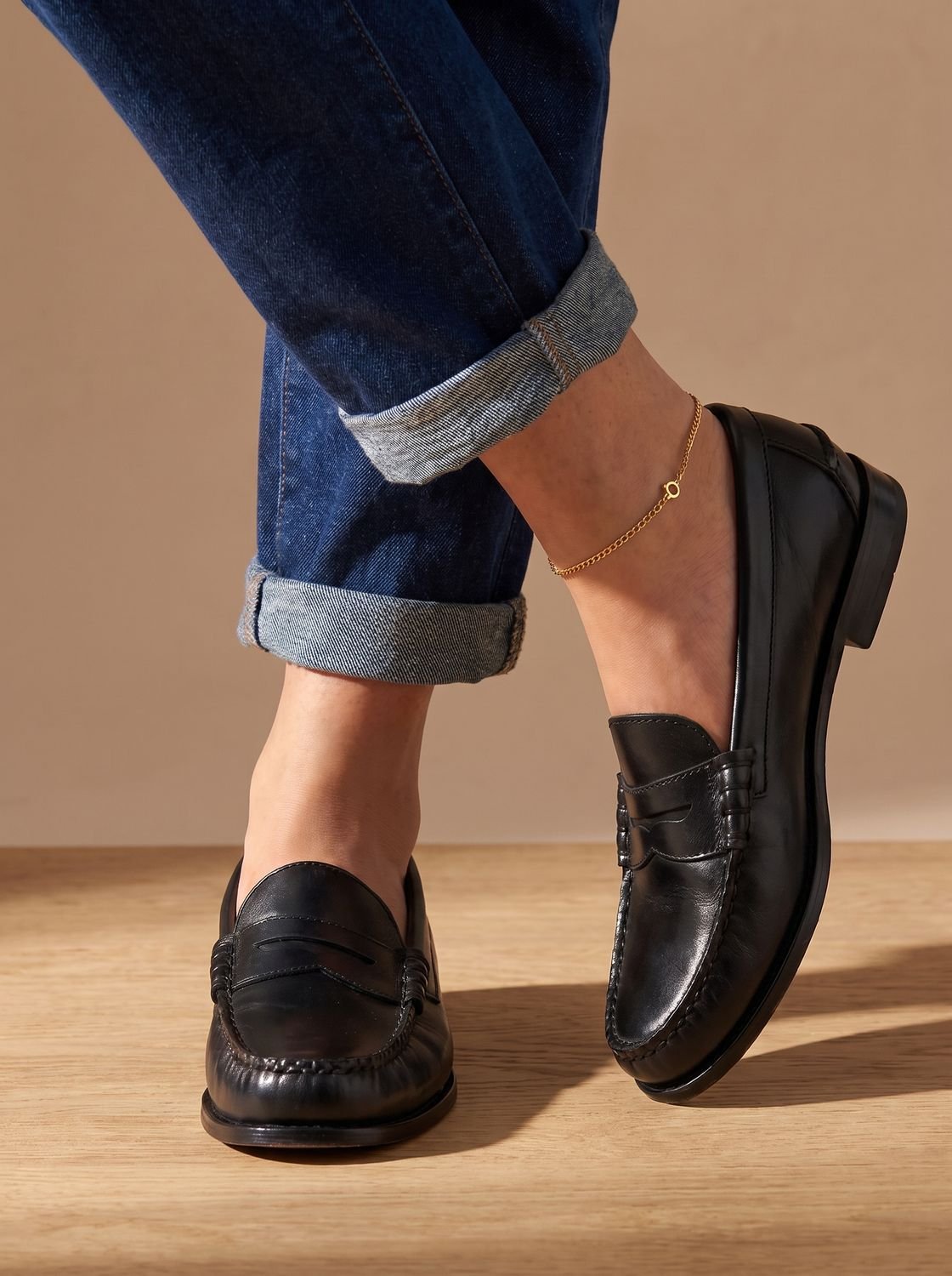 Women's penny loafers with moc toe stitching and low heels