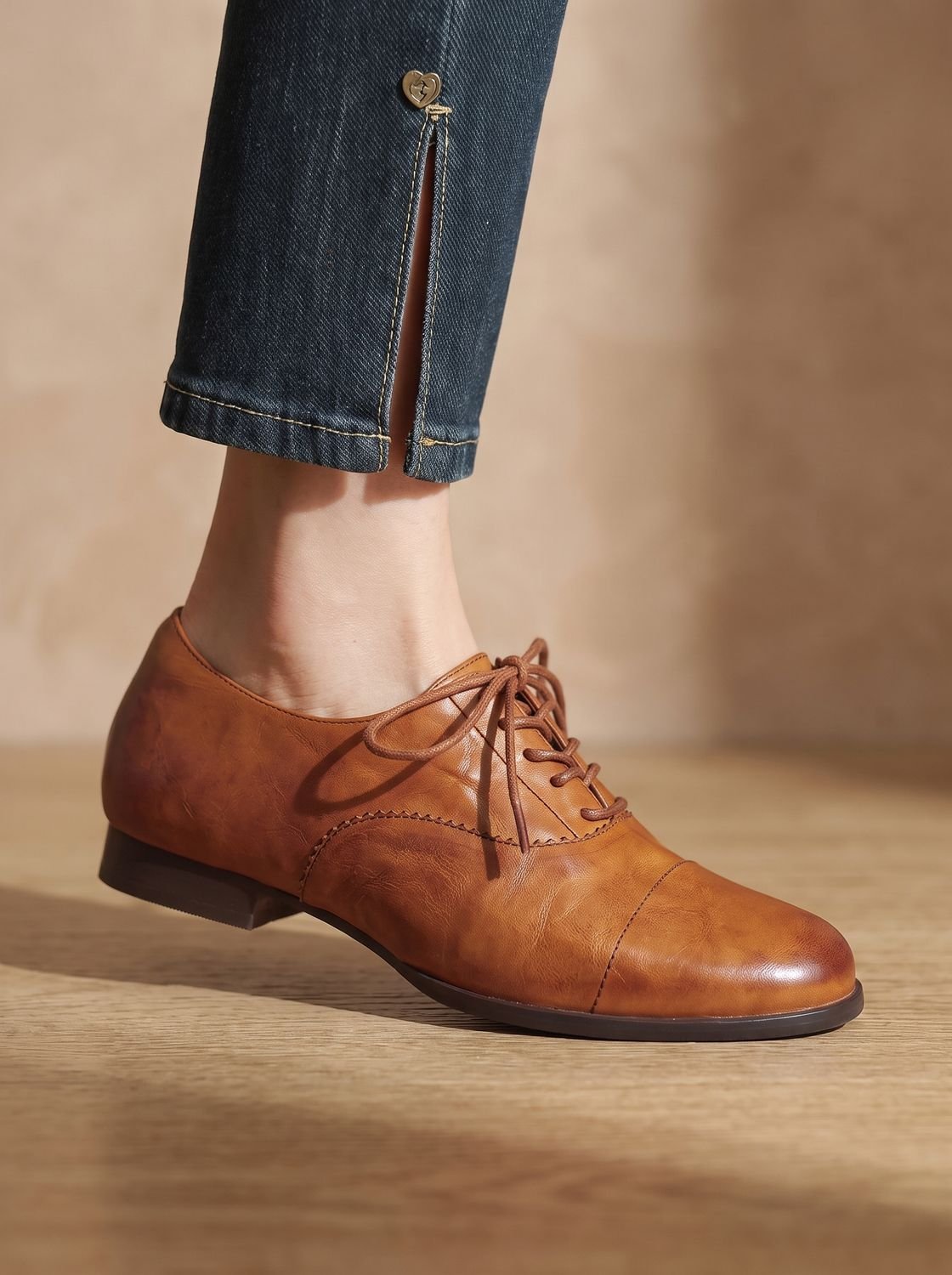 Women's brown cap toe lace-up Oxford shoes with low heels