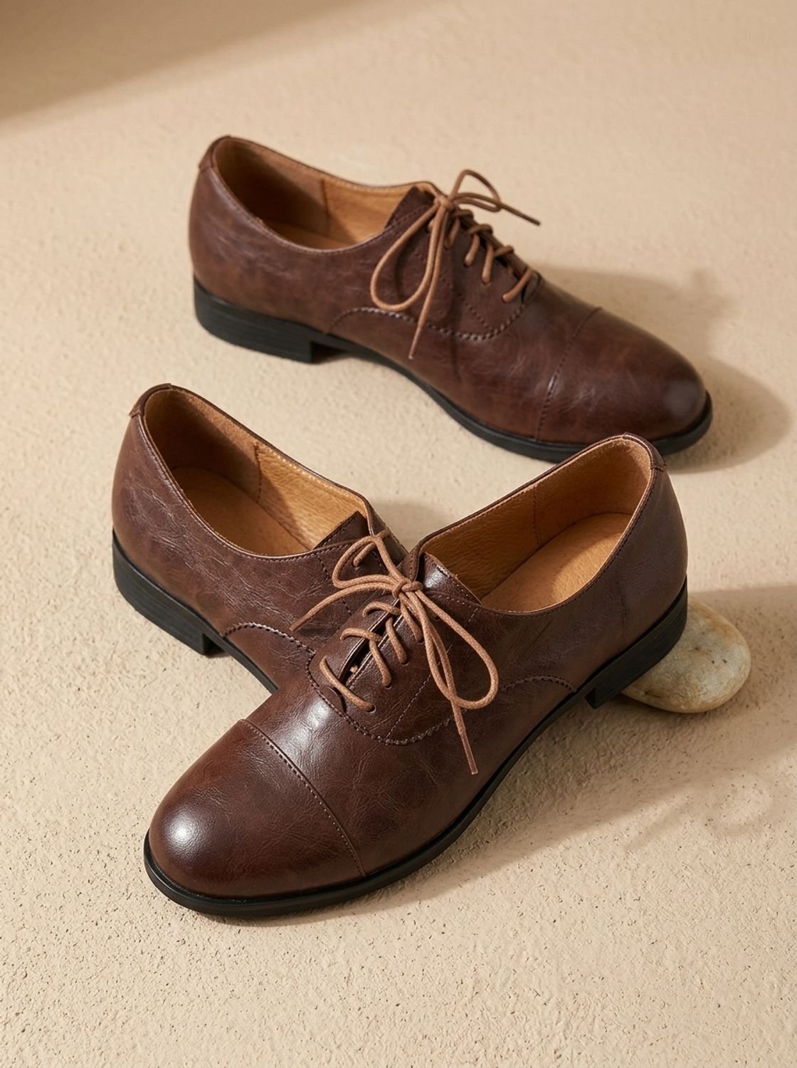 Women's brown cap toe lace-up Oxford shoes with low heels