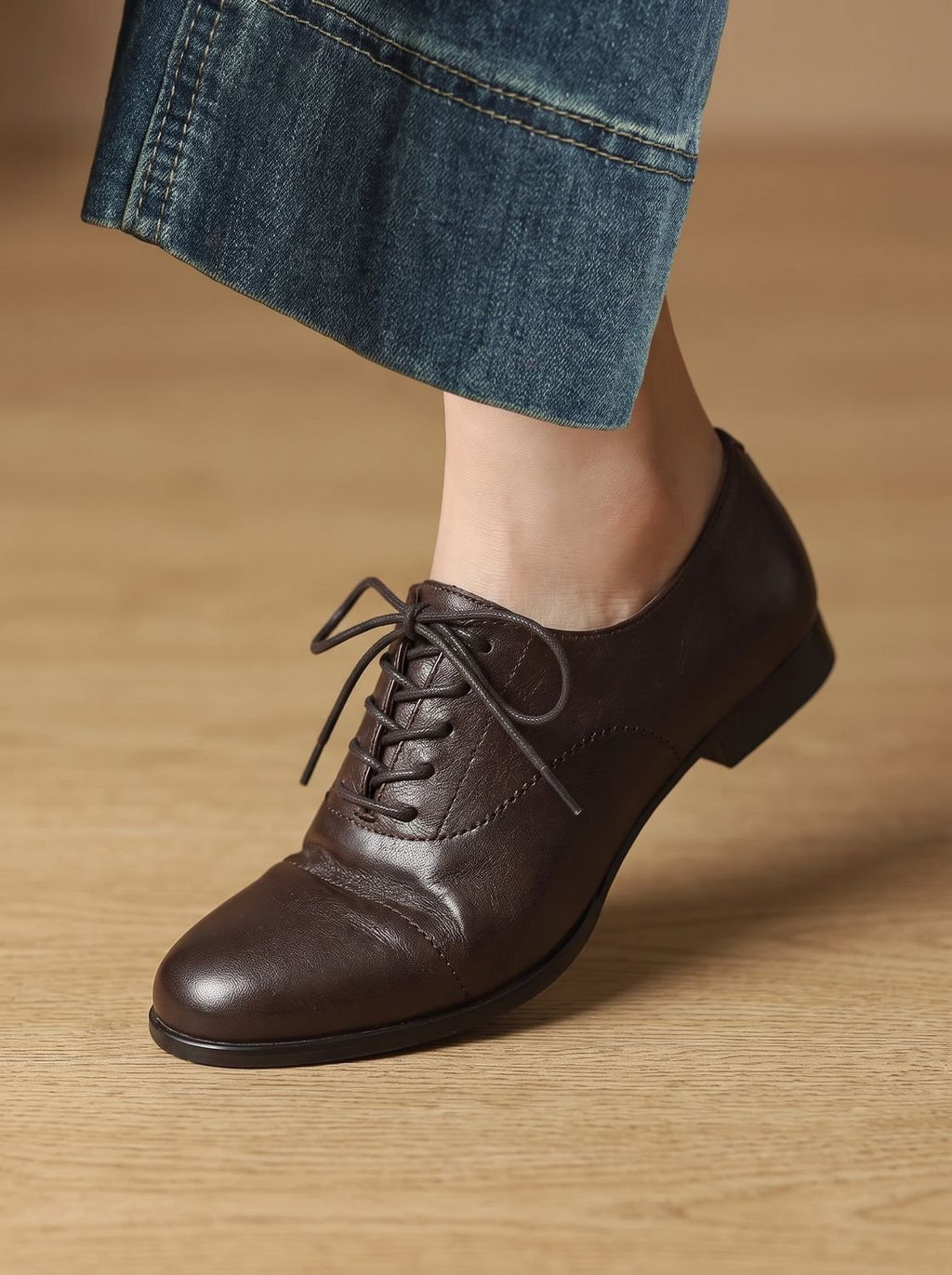 Women's brown cap toe lace-up Oxford shoes with low heels