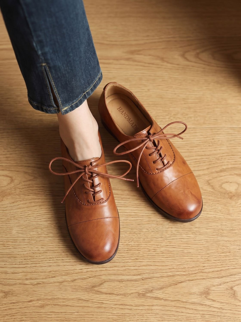 Women's brown cap toe lace-up Oxford shoes with low heels