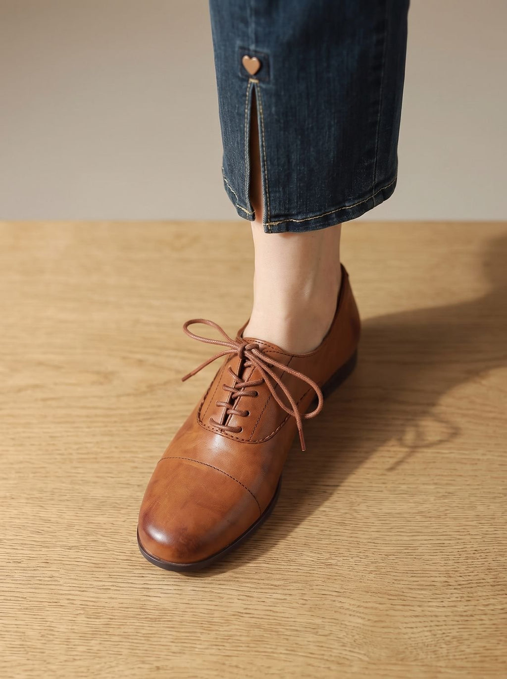 Women's brown cap toe lace-up Oxford shoes with low heels