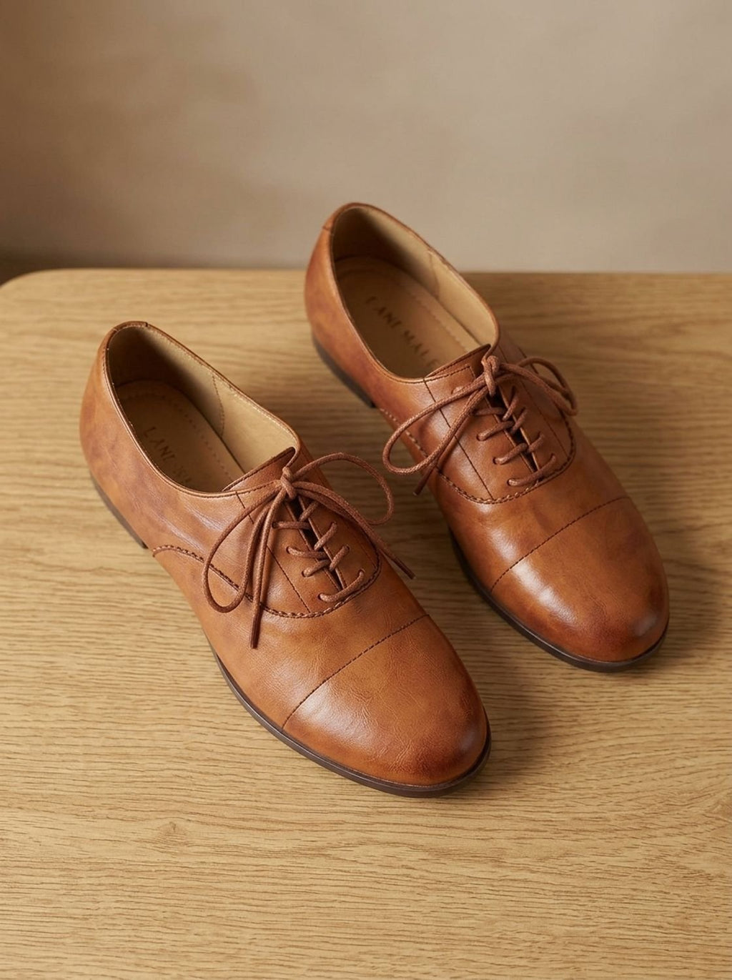Women's brown cap toe lace-up Oxford shoes with low heels