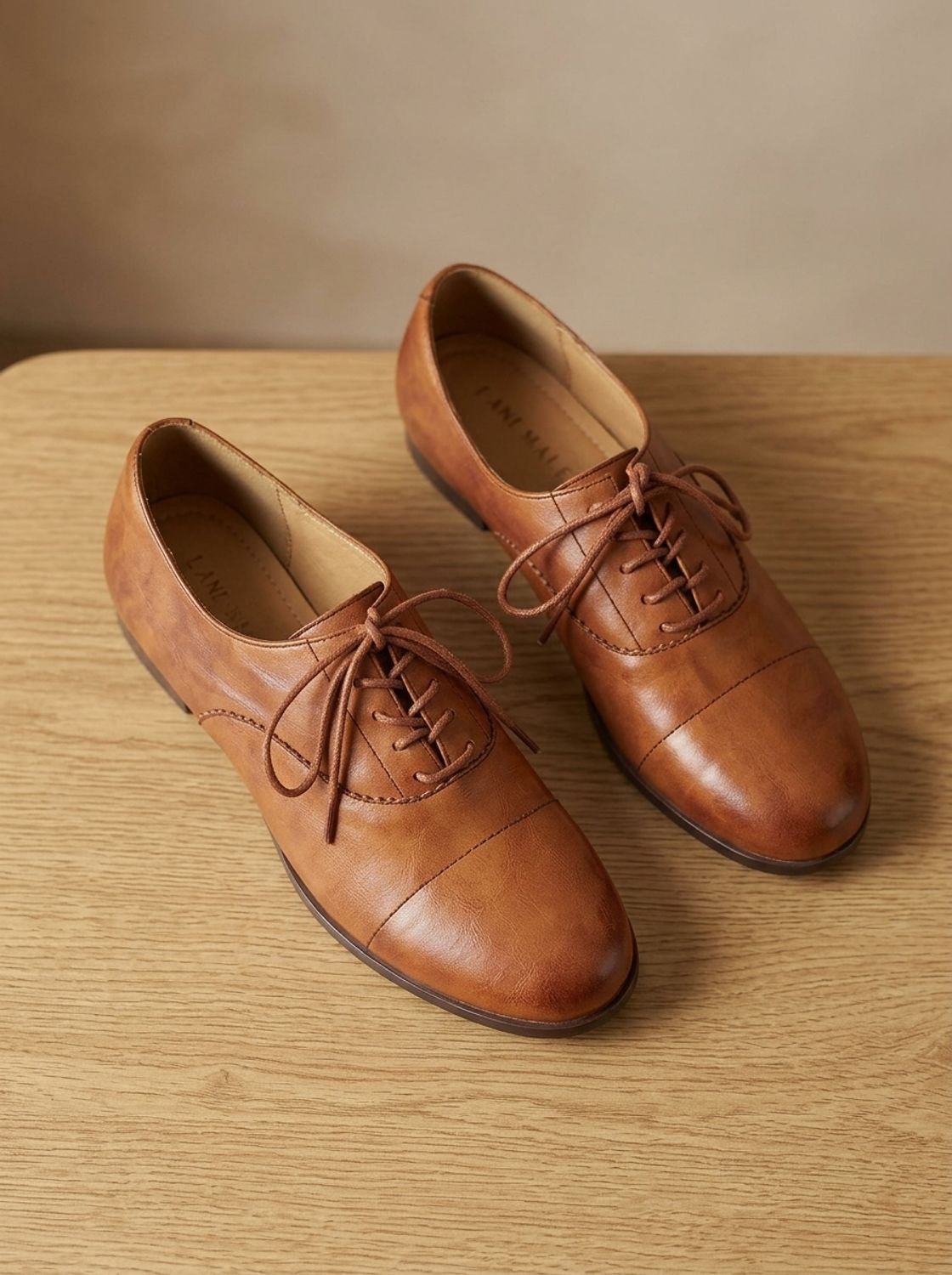 Women's brown cap toe lace-up Oxford shoes with low heels