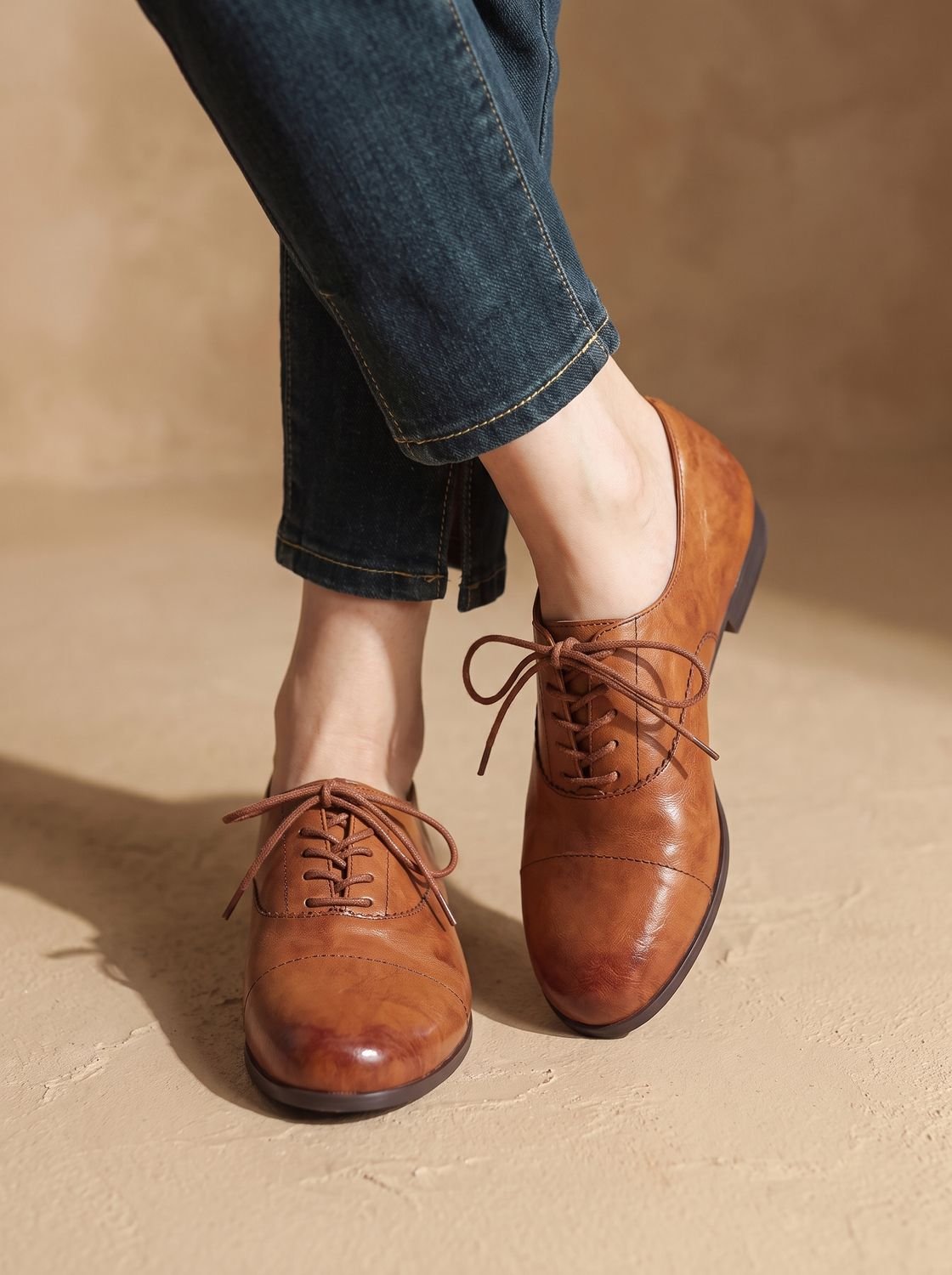 Women's brown cap toe lace-up Oxford shoes with low heels