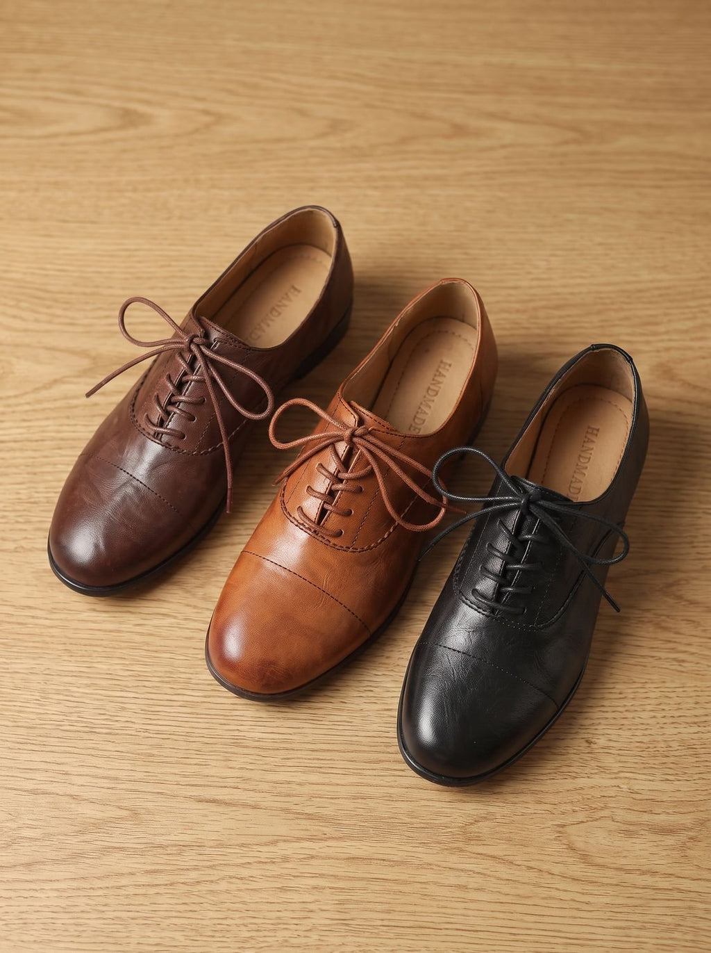 Women's brown cap toe lace-up Oxford shoes with low heels