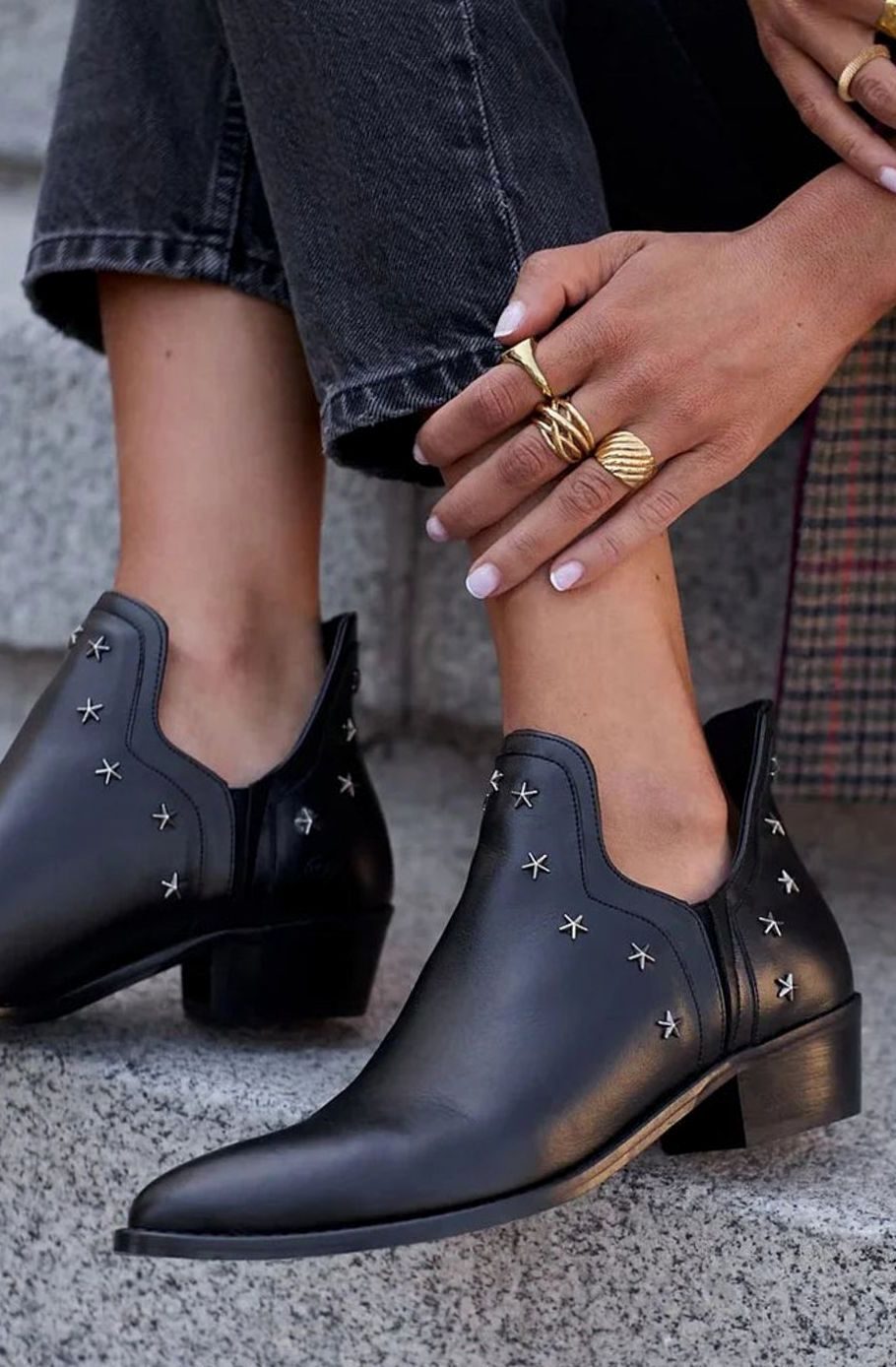 Black pointed toe ankle boots with star studs, cut-out sides and block heels