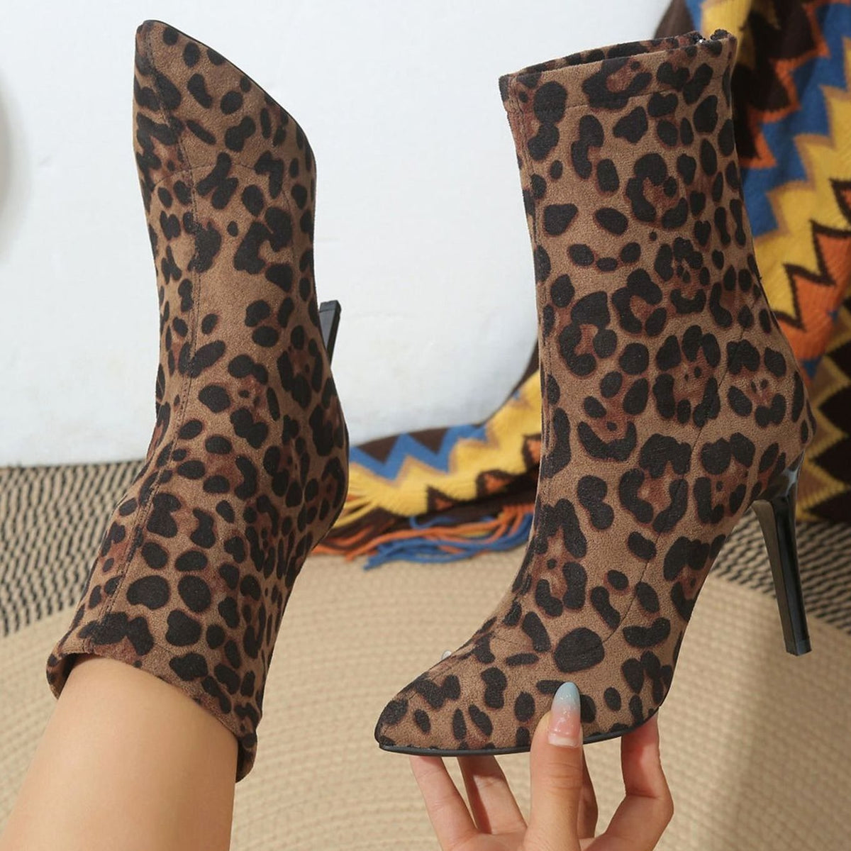 Women's brown and black leopard print pointed-toe ankle boots with high stiletto heels