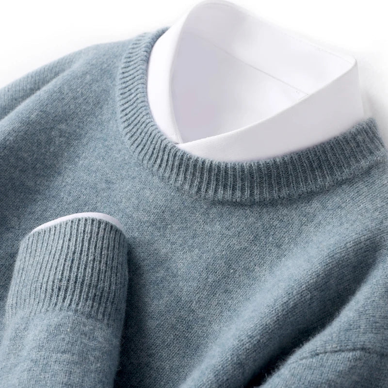 Men's textured knit crew neck sweater shown in light blue and black with long sleeves and ribbed edges