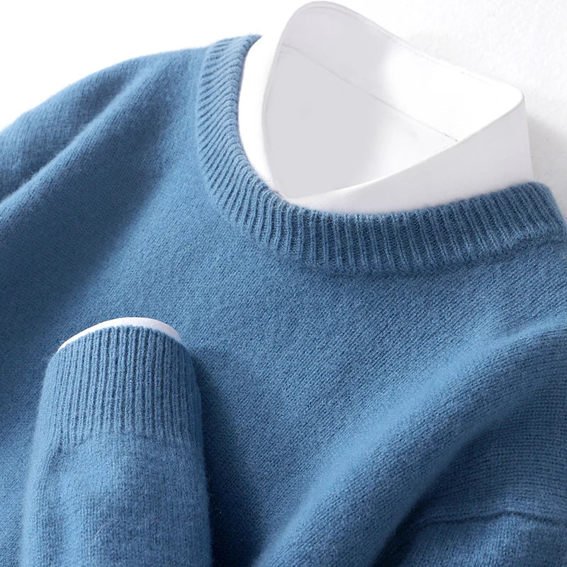 Men's textured knit crew neck sweater shown in light blue and black with long sleeves and ribbed edges
