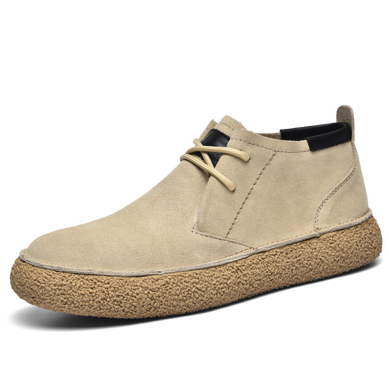 Men's lace-up chukka ankle boots with rounded toes, dark collar trim and textured soles