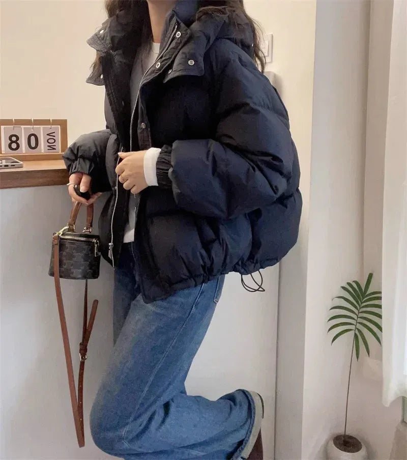 Women's cropped quilted puffer jacket with hood, long sleeves and zip front