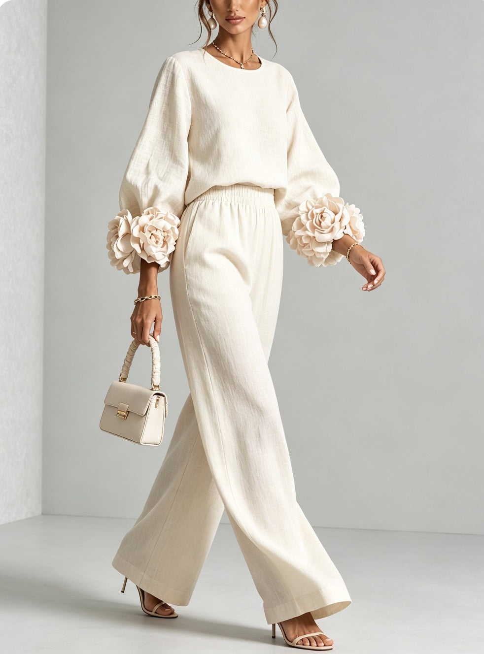 Women's two-piece set with round-neck top, rosette cuffs and wide-leg trousers