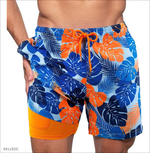Short de bain 2-en-1 à imprimé palmiers, avec doublure de compression