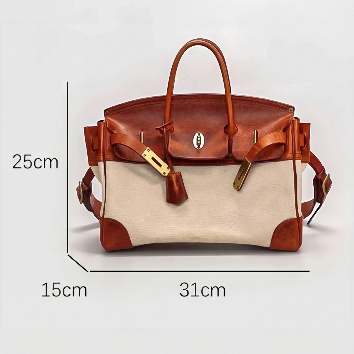 Women's two-tone brown and cream structured top handle bag with turn-lock flap