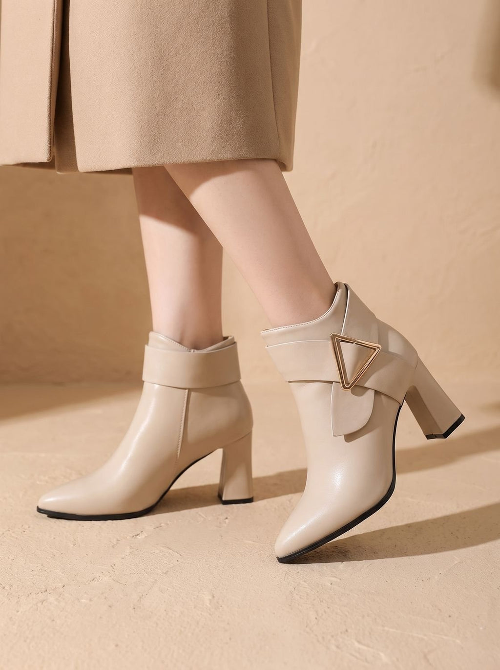 Women's pointed toe ankle boots with wraparound strap, triangular buckle and block heel