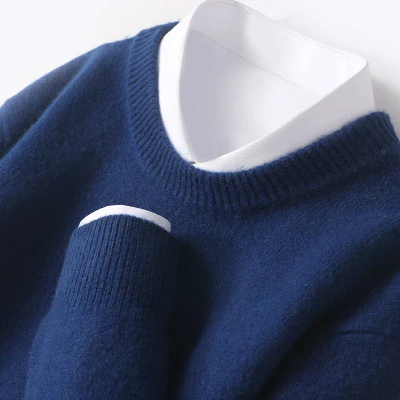 Men's textured knit crew neck sweater shown in light blue and black with long sleeves and ribbed edges