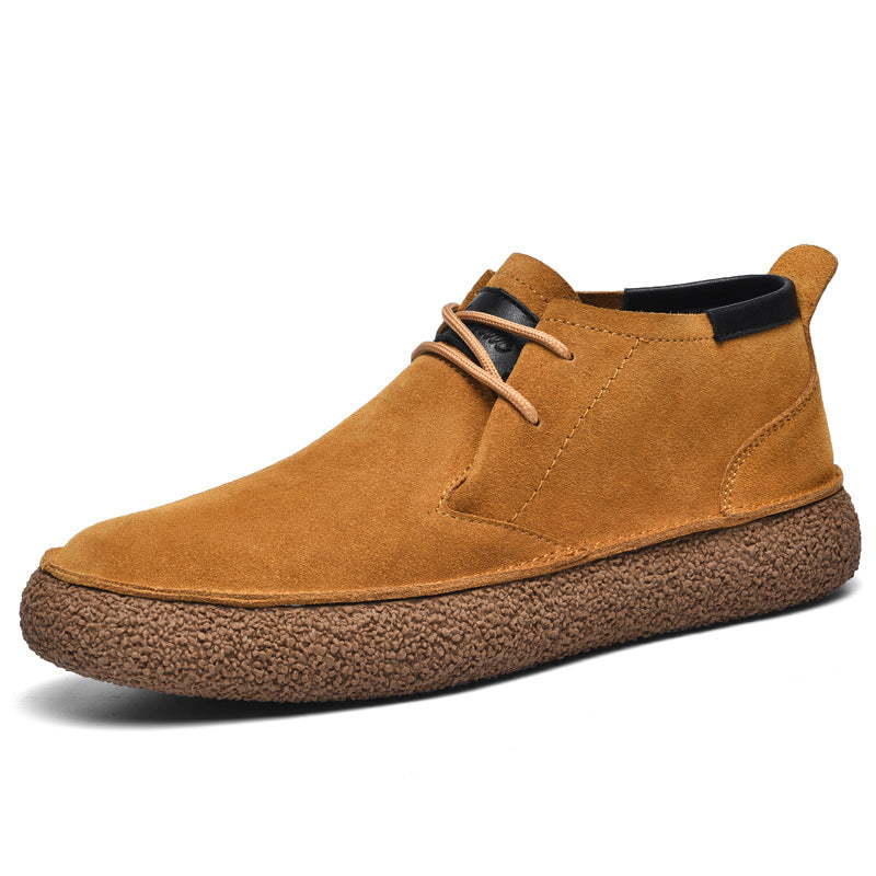 Men's lace-up chukka ankle boots with rounded toes, dark collar trim and textured soles