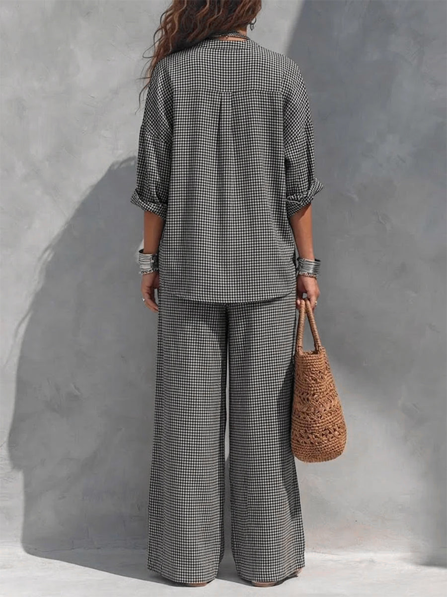 Women's black and white checked wide leg trousers with elastic waist and side pockets