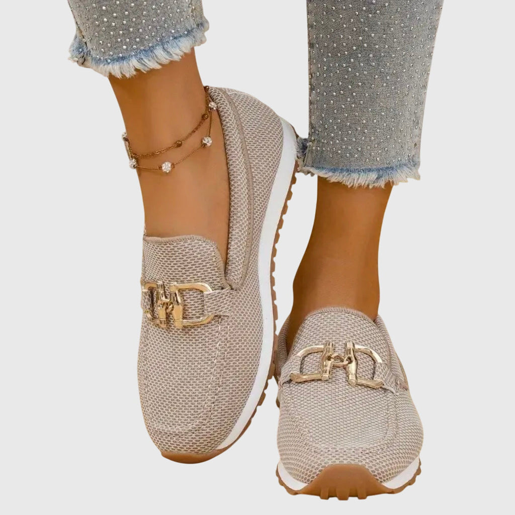 Women's textured loafer sneakers with rounded toes and decorative metal trims