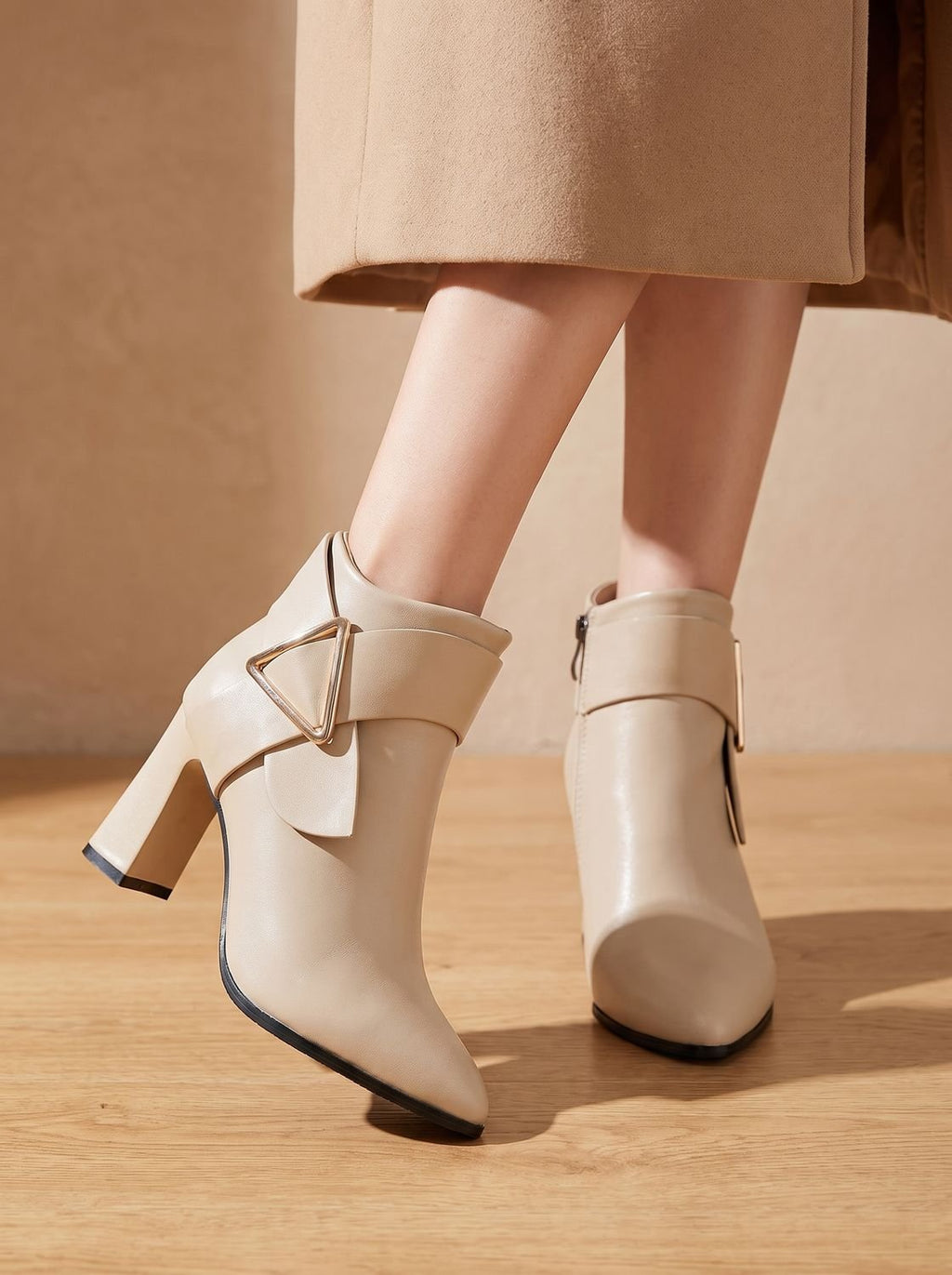 Women's pointed toe ankle boots with wraparound strap, triangular buckle and block heel